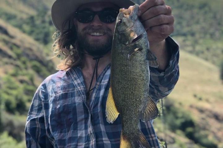 a man holding a fish